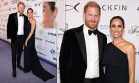 Meghan wears Princess Diana's diamond and sapphire earrings as she steps out with Prince Harry to support music mogul friend David Foster