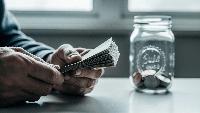 Paycheck-to-paycheck living falls 21 points in a year but nearly half of Americans remain financially stretched