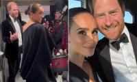 Meghan Markle beams 'my husband loves bagpipes!' as she and Prince Harry share banter with Scottish band at event to support music mogul friend
