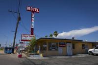 Woman stabbed at Las Vegas motel sues property, escort website