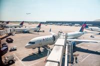 Passengers evacuate down slide at Atlanta airport shortly after smoke forces emergency landing