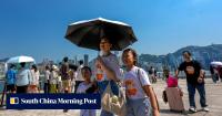 Hong Kong records hottest day in 142 years as Typhoon Dolphin brings extreme heat