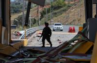Bombing attacks mark first day of Colombia's new government, leaving one police officer dead
