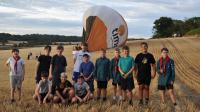 Scouts on camping trip help land Fiesta balloon