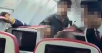 Plane passenger restrained with cable ties after trying to open aircraft door mid-flight