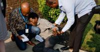 ‘We're not going to let them do it in the shadows’: Hundreds rally at site where Haitians required to check-in, get monitors after end of TPS