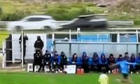 Wild moment players kick soccer ball onto busy road and cause chaotic car crash