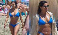 Eva Longoria, 51, makes a splash in electric blue bikini as she displays her gym-honed figure during beach day