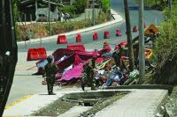 Bombing attacks mark first day of Colombia’s new right-wing government; one officer dead