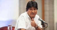 Why is Evo Morales still free despite the two arrest warrants against him?