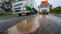 Drivers stranded on Princes Highway as potholes wreak carnage in wild weather across Victoria
