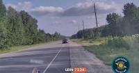Man charged after video shows car nearly hitting Michigan police vehicle