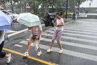 Typhoon Dolphin weakens but disrupts travel in east China