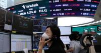 Asian shares are mixed after gains on Wall Street, while oil prices climb