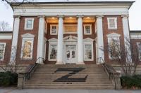 Where does U.Va.'s DOJ agreement stand among five other university settlements?