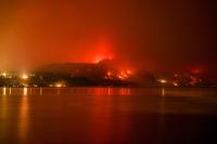 Thousands evacuated as wildfires burn across western US and Canada