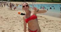 Brittany Mahomes Takes Over the Beach in Red Burberry X Hunza G Bikini