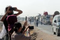 Syrian Kurds begin return to border town seized by Turkey