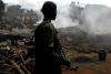Rebels wielding machetes and hoes kill at least 52 in eastern DRC