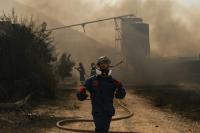 Greece contains new wind-driven fire near Athens