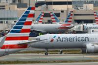 American Airlines Ends Complimentary Business Class Upgrades for Economy Passengers on Some Flights