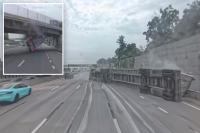 Terrifying footage shows huge tractor-trailer slam into New York overpass, tip over on busy highway