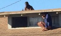 The blood-chilling true story behind photograph of California actress crouching on a roof as intruder closed in