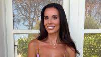 England Wag shows off tan lines in stunning low-cut dress as she shares holiday snaps after World Cup