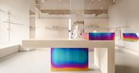 iridescent metal and textured plaster shape rikky hype showroom in kyiv