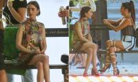 Lily Collins cuts a chic figure in a patterned minidress as she joins Ashley Park to film the final season of Emily In Paris