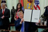 Explainer-Trump’s childhood vaccine order: what it does and what doctors say