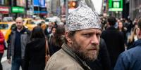 Believing the world is unfair may explain why some who experience adversity are drawn to conspiracy theories