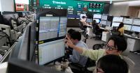 Shares are mixed in Europe and Asia ahead of US inflation report, while oil prices gain