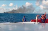 Indonesian rescuers evacuate dozens from a burning ferry that left at least 1 dead near Bali
