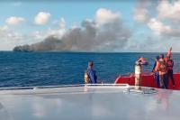 Indonesian rescuers evacuate dozens from a ferry fire that left at least 1 dead near Bali