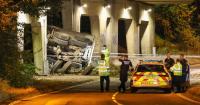 Lorry driver dies after vehicle plunges 20ft from motorway bridge