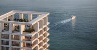 OODA designs DUAS towers as a pair of marble figures gazing over albania’s coast
