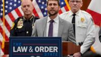 Florida attorney general embraces culture warrior role. With signs.