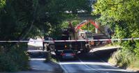 Lorry crashes and falls off bridge as motorway partially shuts