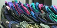 Backpack giveaway aims to ease back-to-school costs for families in East Lansing
