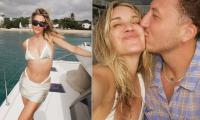 Pussycat Dolls star Ashley Roberts, 44, poses in a daring thong bikini as she packs on the PDA with toyboy George Rollinson, 26, in Barbados