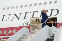 AP News: The Latest: Trump says he was taken off Air Force One last month due to threat