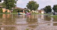 Families in Hammond, Indiana, deal with storm damage and flooding amid power outages