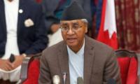 Former Nepal PM Deuba returns home after five months abroad amid money-laundering probe