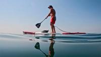 Surfer completes 900km Portugal paddle in tribute to Arran Strong