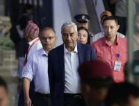 Former Nepal PM Deuba returns amid money-laundering investigation