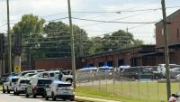 Student wounded, young suspect in custody after shooting at Georgia high school