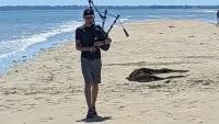 Hamilton College pupil piped on beaches of Normandy during summer holiday