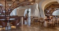 falwa restaurant transforms arabian equestrian heritage into fluid architectural interior
