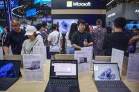 Microsoft retreats in China, but AI helps it keep a window open